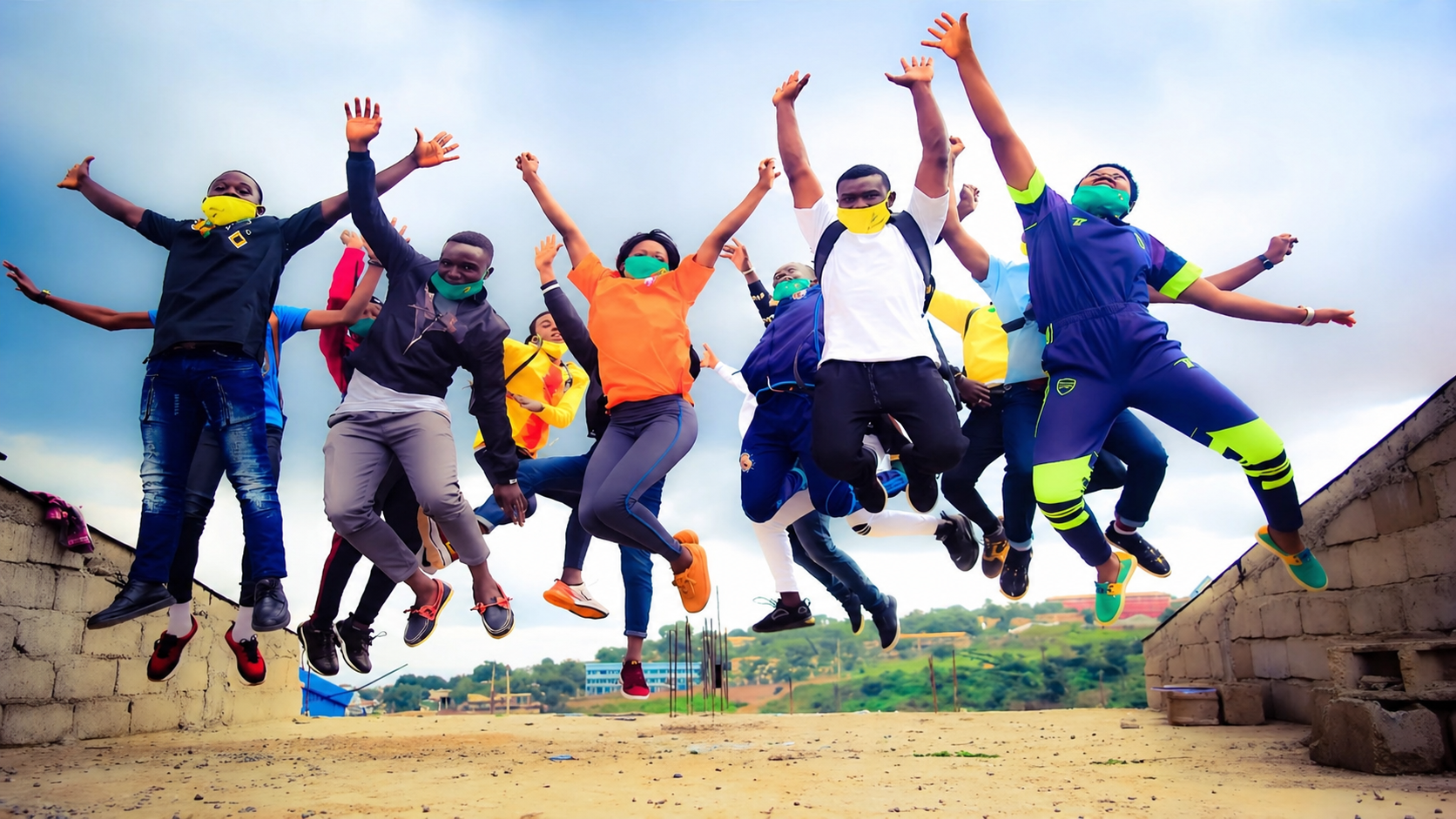Young PICHNET participants jumping together outdoors.